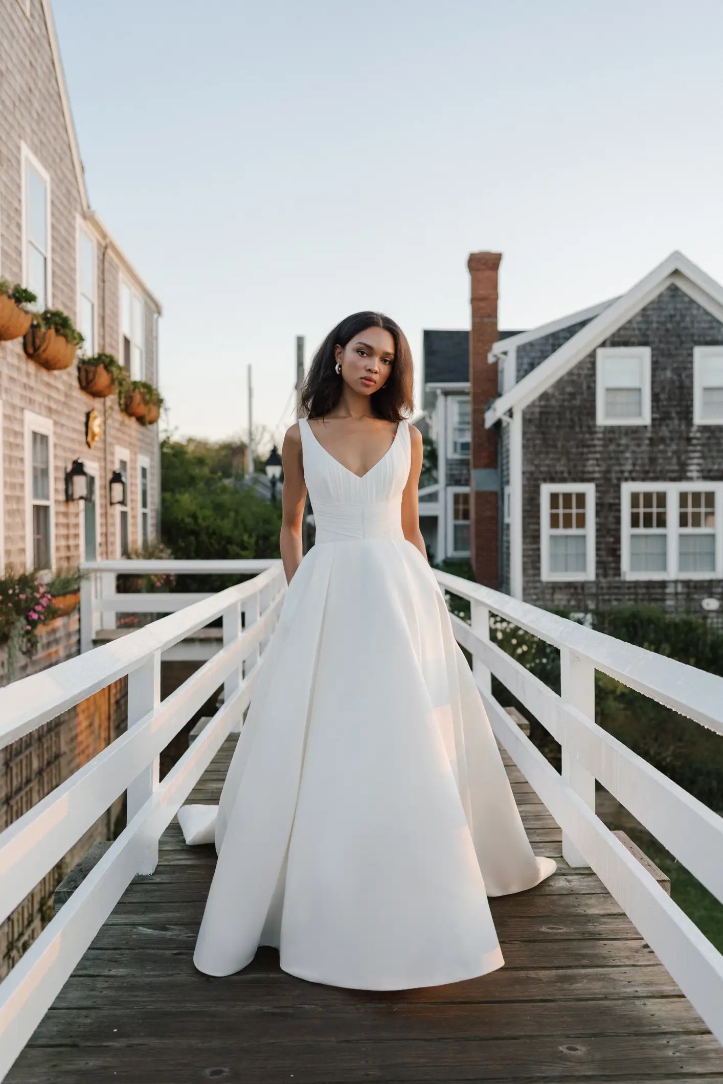 Birdsong wedding dress by Anne Barge with v neckline and pleated bodice, large ballgown skirt