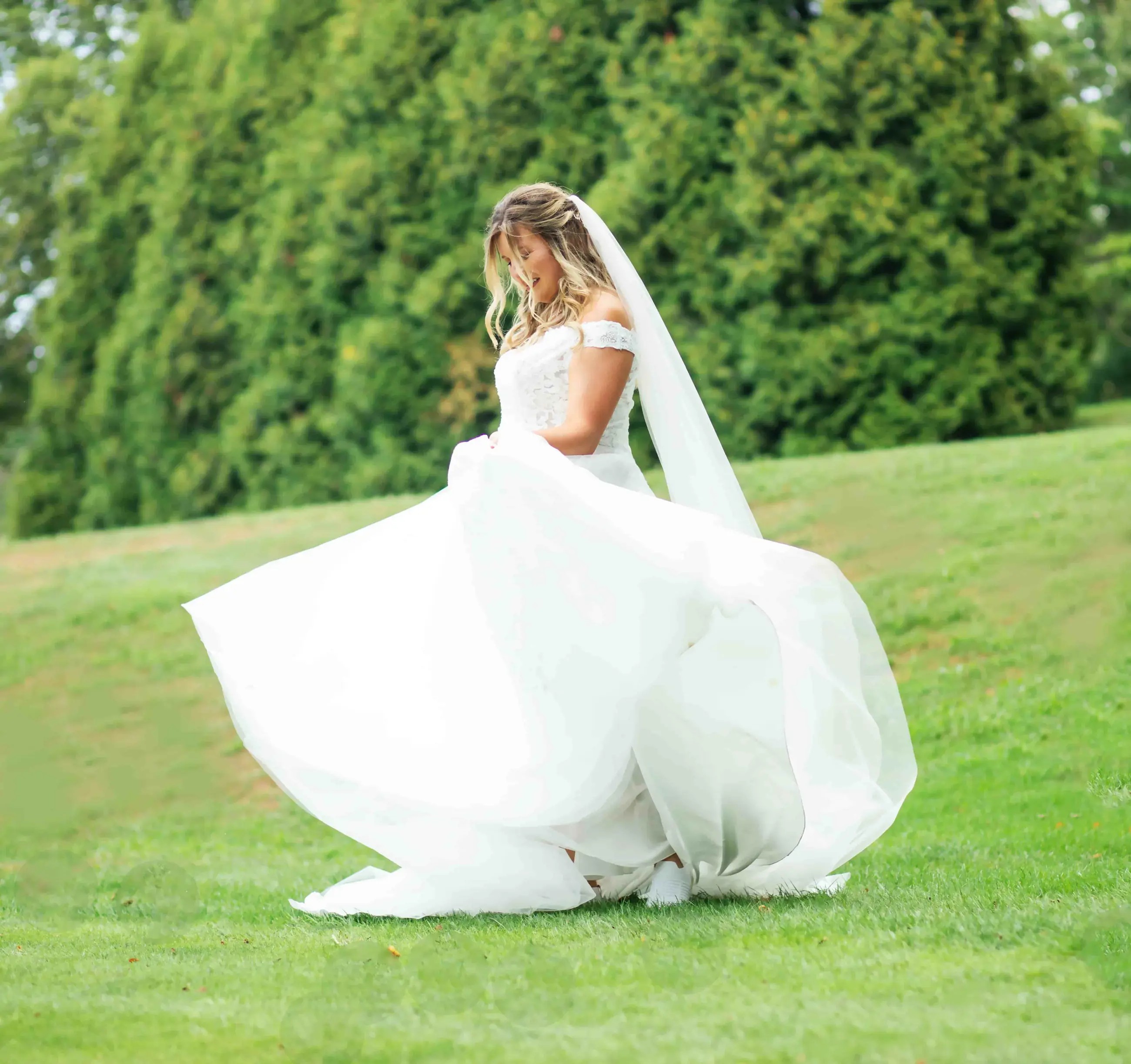 Сouple wearing a white gown and a white suit